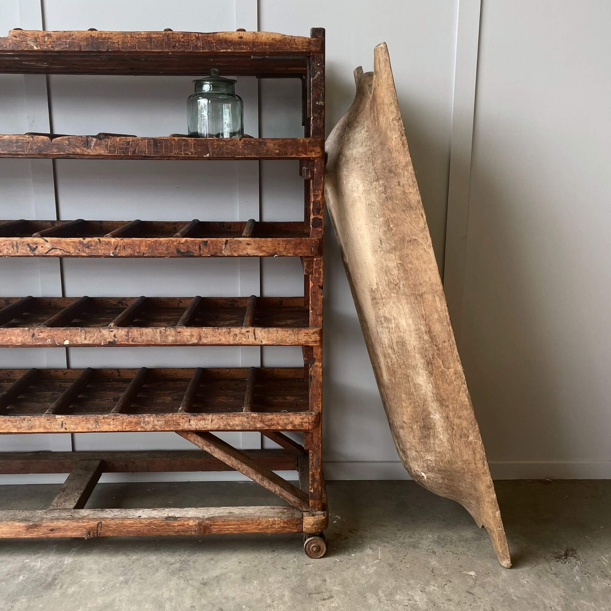 Side view of dough bowl with jars and shelves