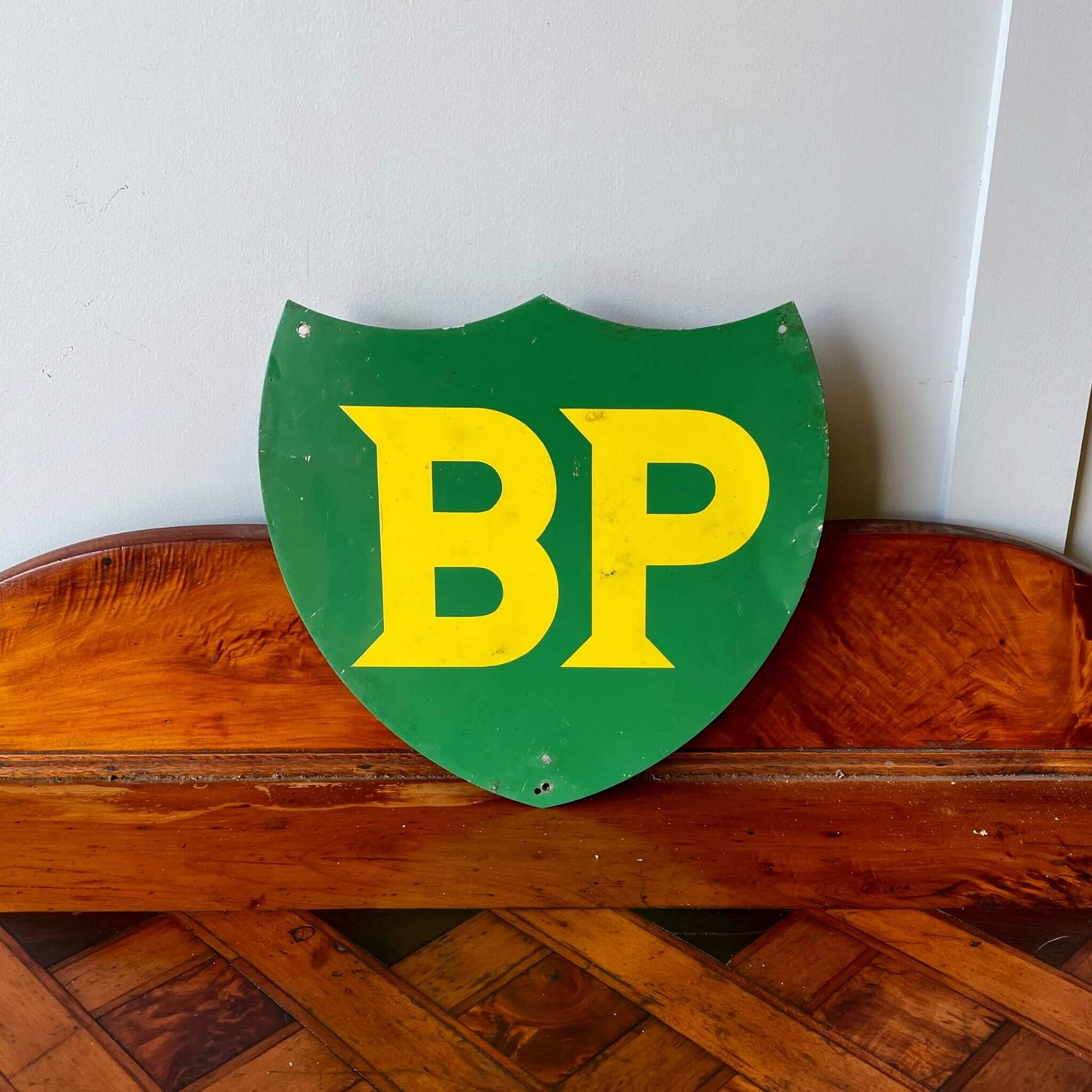 An antique and collectible BP Collectable Bowser Shield