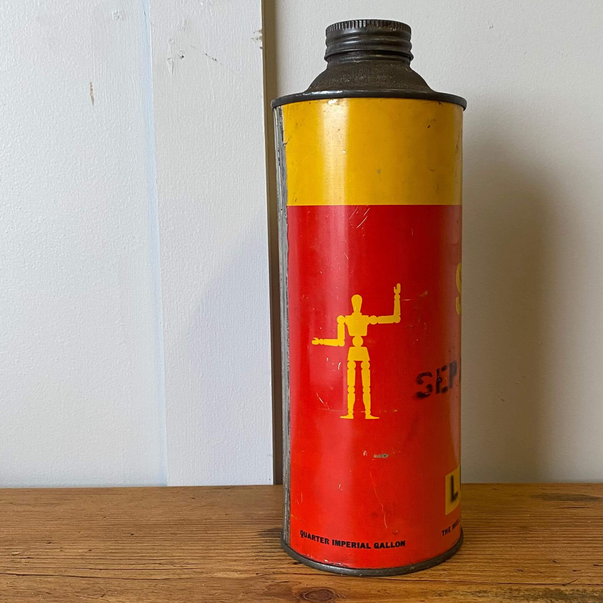 Vintage garage collectible Shell Stickman Tin