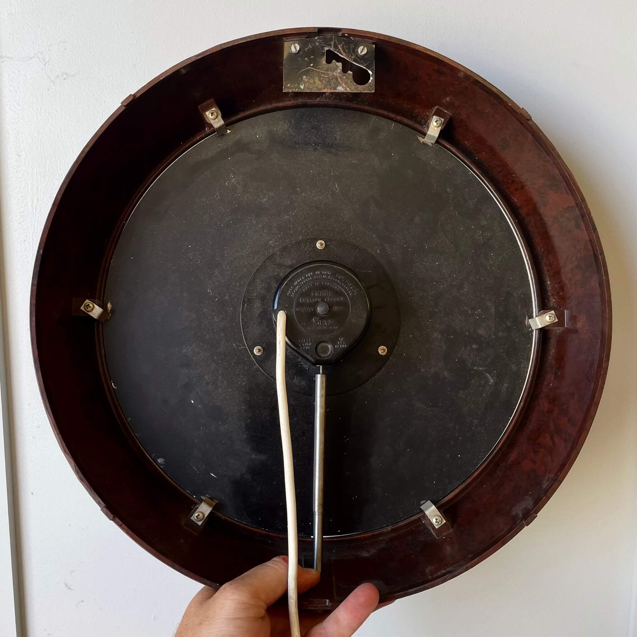Back of a bakelite wall clock