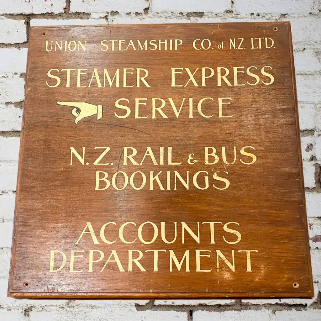 Size 55cm x 55cm. Union Steam Ship Co and New Zealand Railways. Wooden with goldleaf writing.