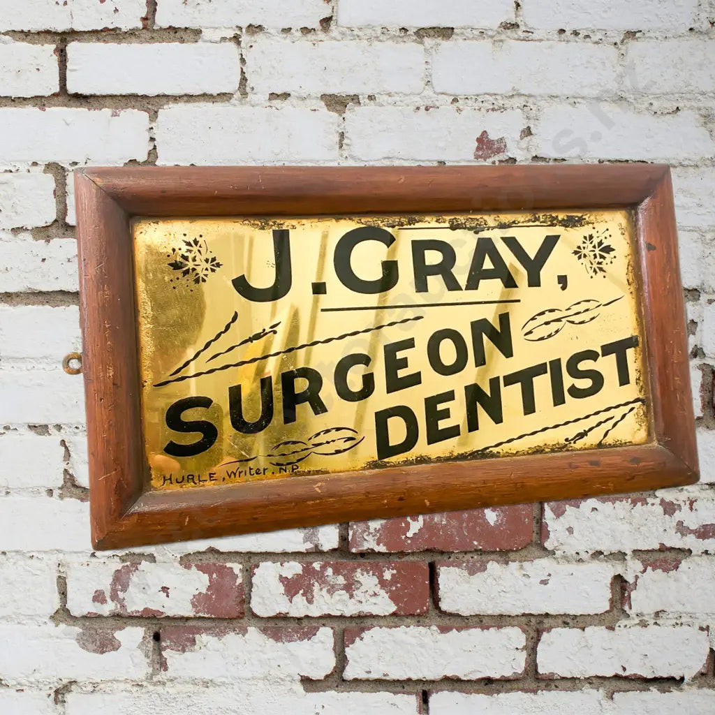 Size 41cm Wide x 31cm High. Early heavy goldleaf sign, Hurle Writers, New Plymouth. Condition good.