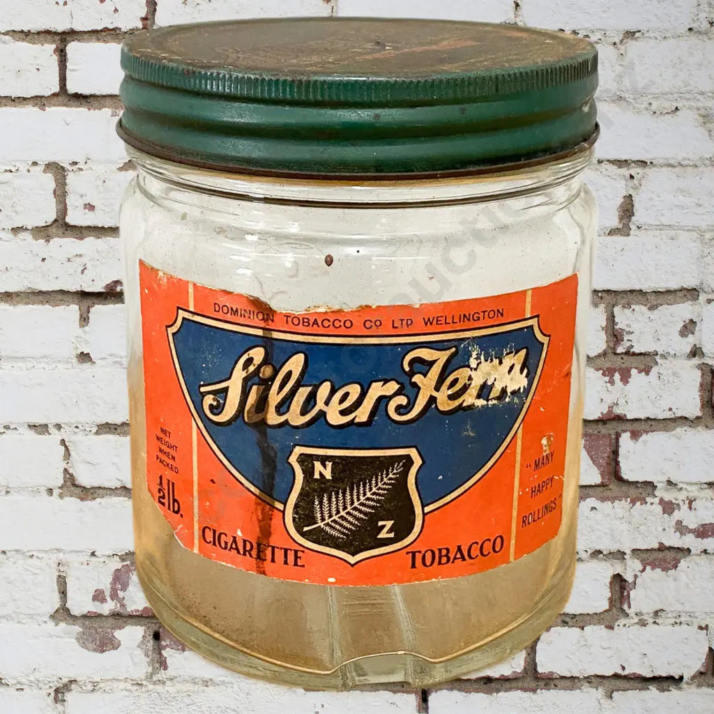 Size 12cm tall x 10cm diameter. Original label, correct lid, stain on label, embossed jar. Condition good.