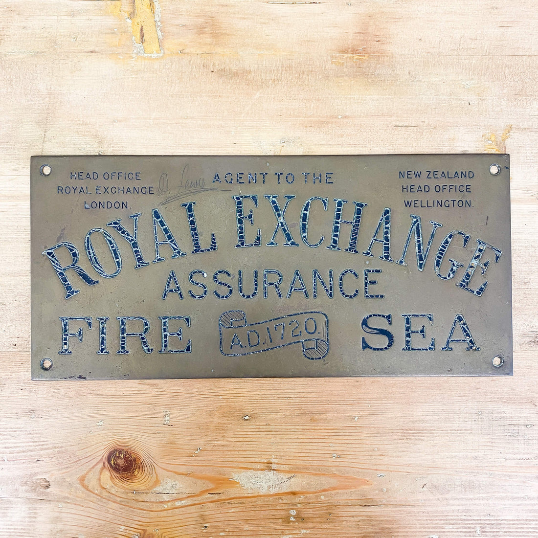 An Early Brass Assurance Sign