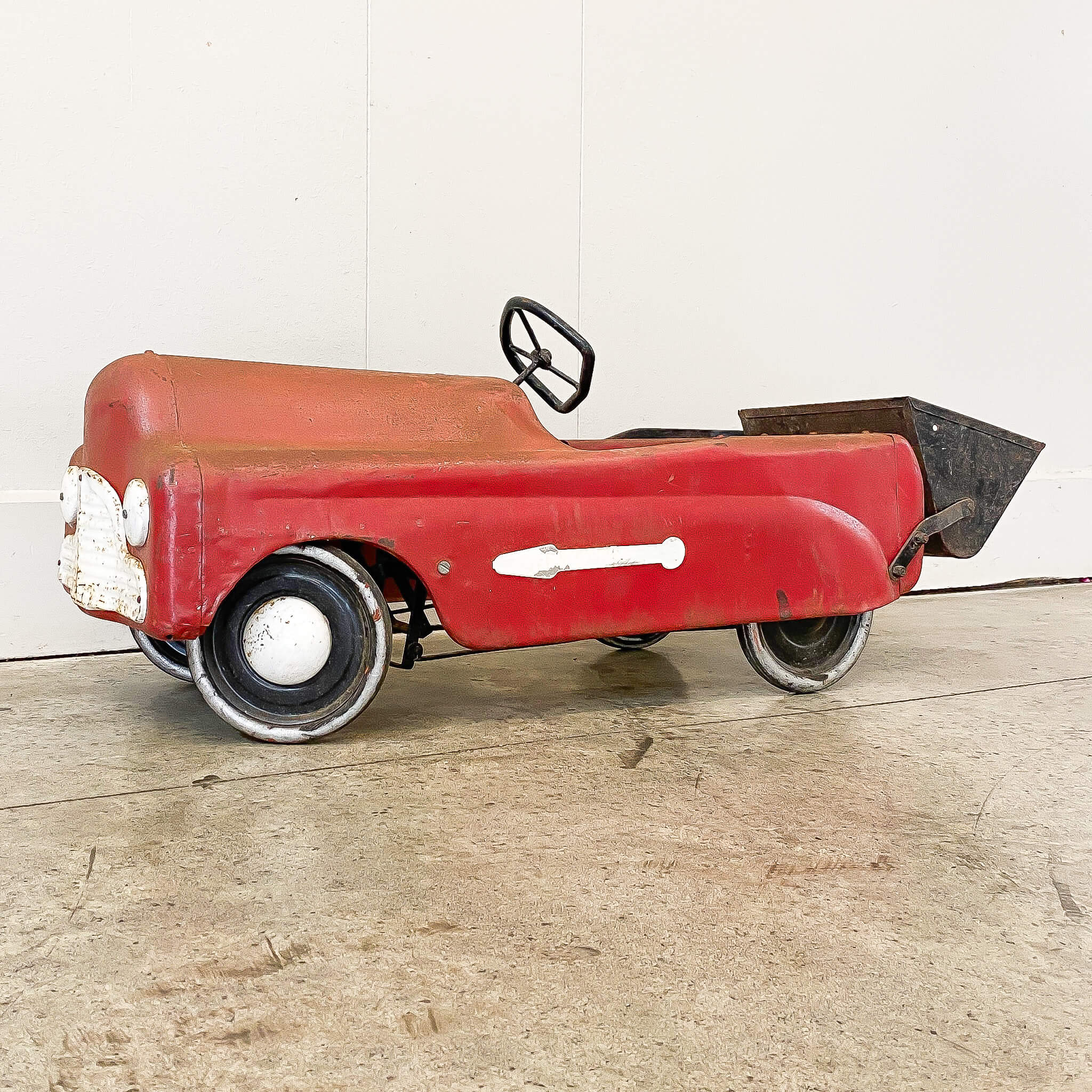 A Vintage Triang Pedal Car