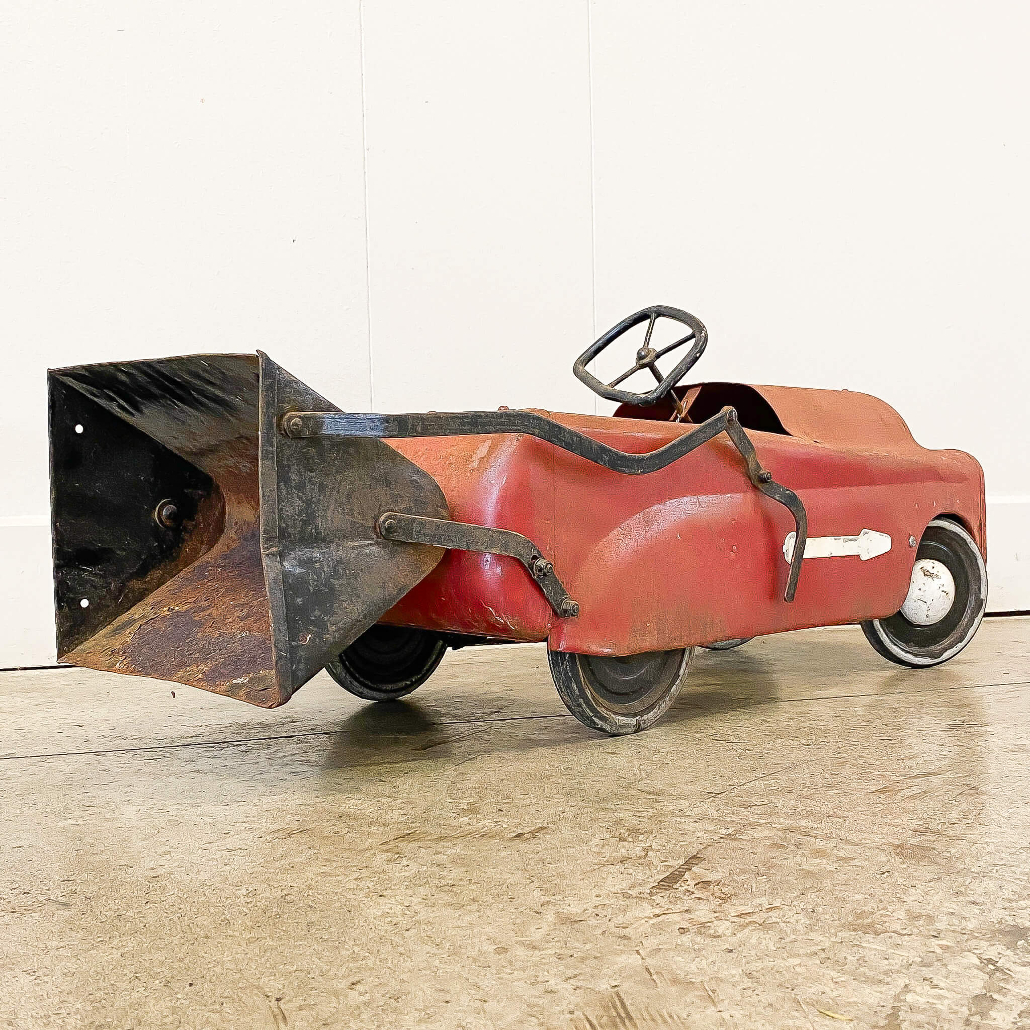 A Vintage Triang Pedal Car