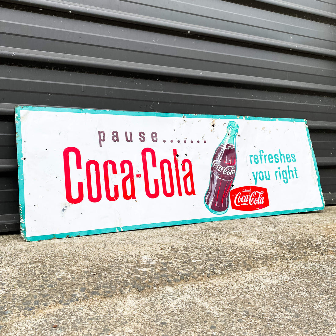 A Vintage Coca Cola Sign