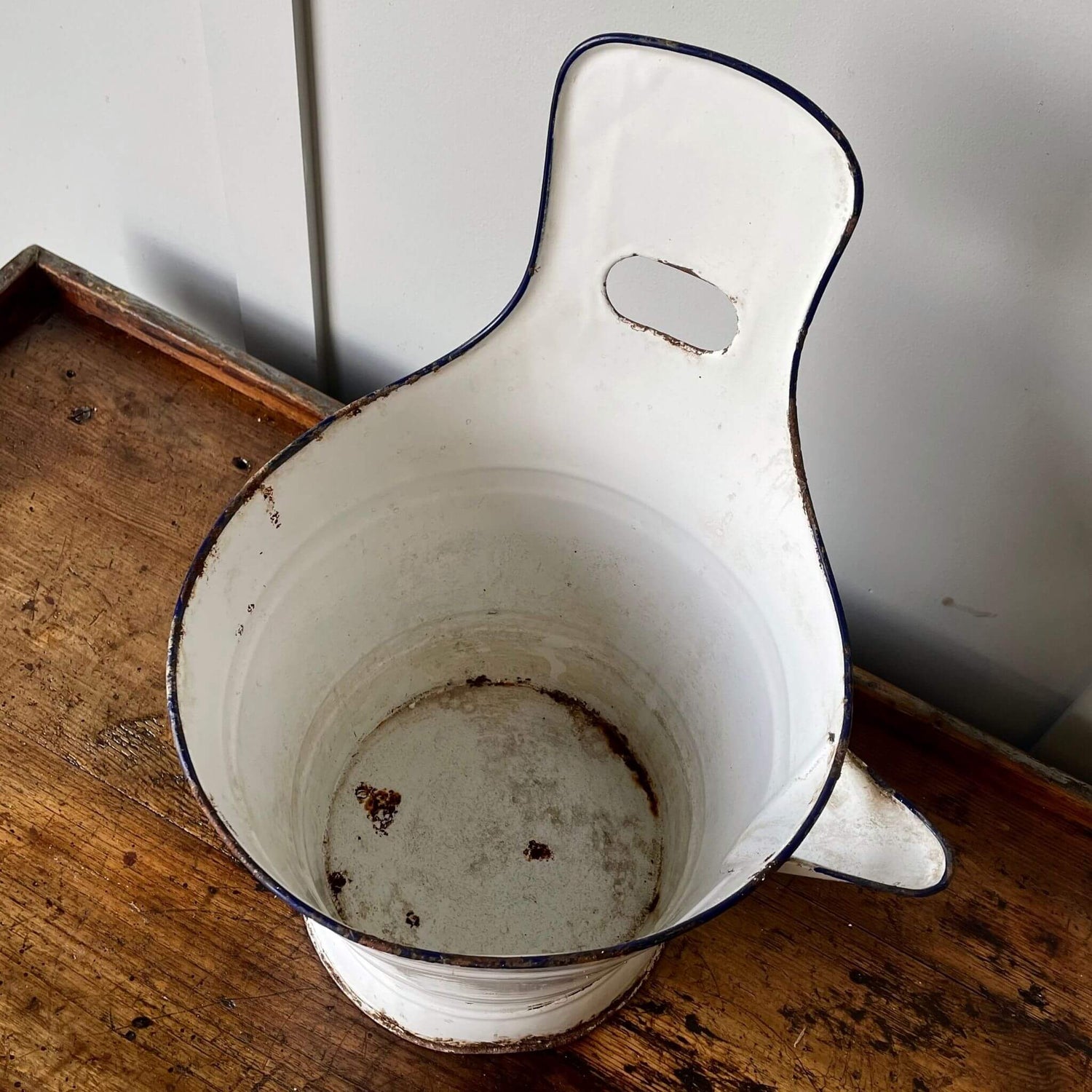 Vintage enamel milking bucket for garden