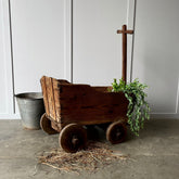 side of a wooden pull along cart