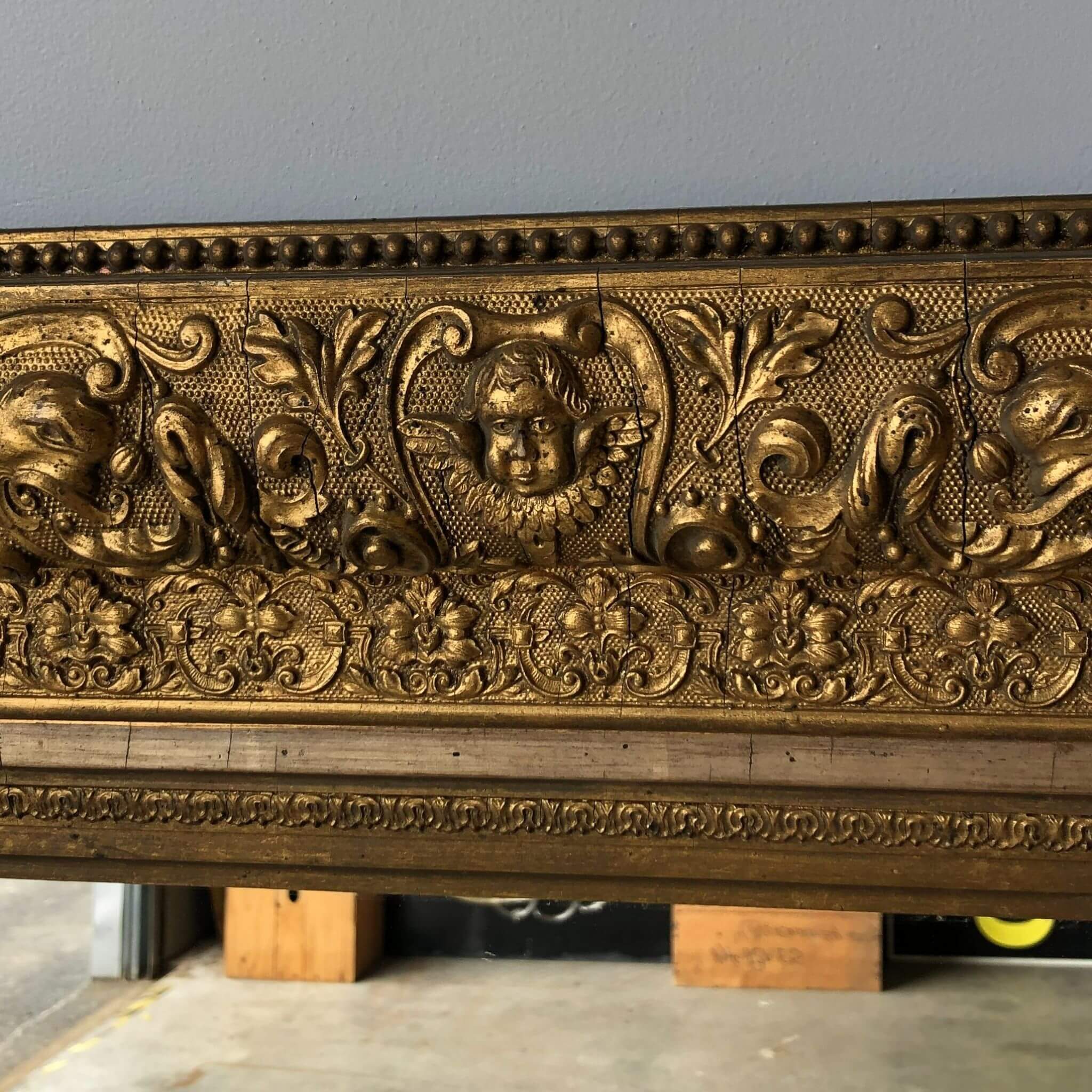 Antique mirror with cherubs