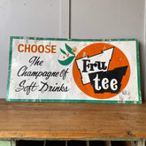 A vintage advertising collectible for Frutee Soft Drinks
