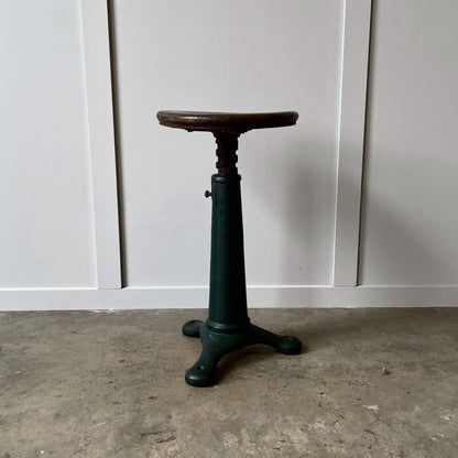 Green old antique factory stool