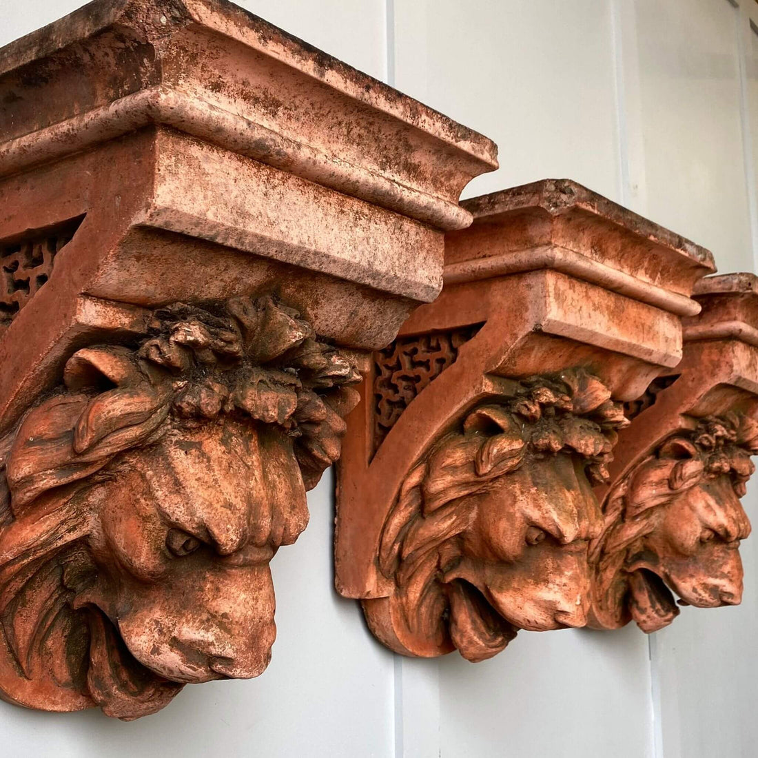 Vintage garden decor, terracotta lion heads