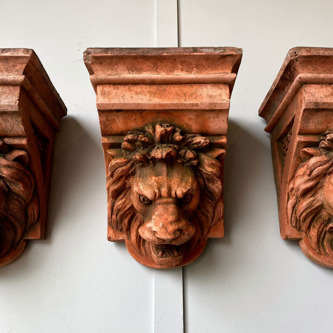 Vintage garden terracotta lion heads