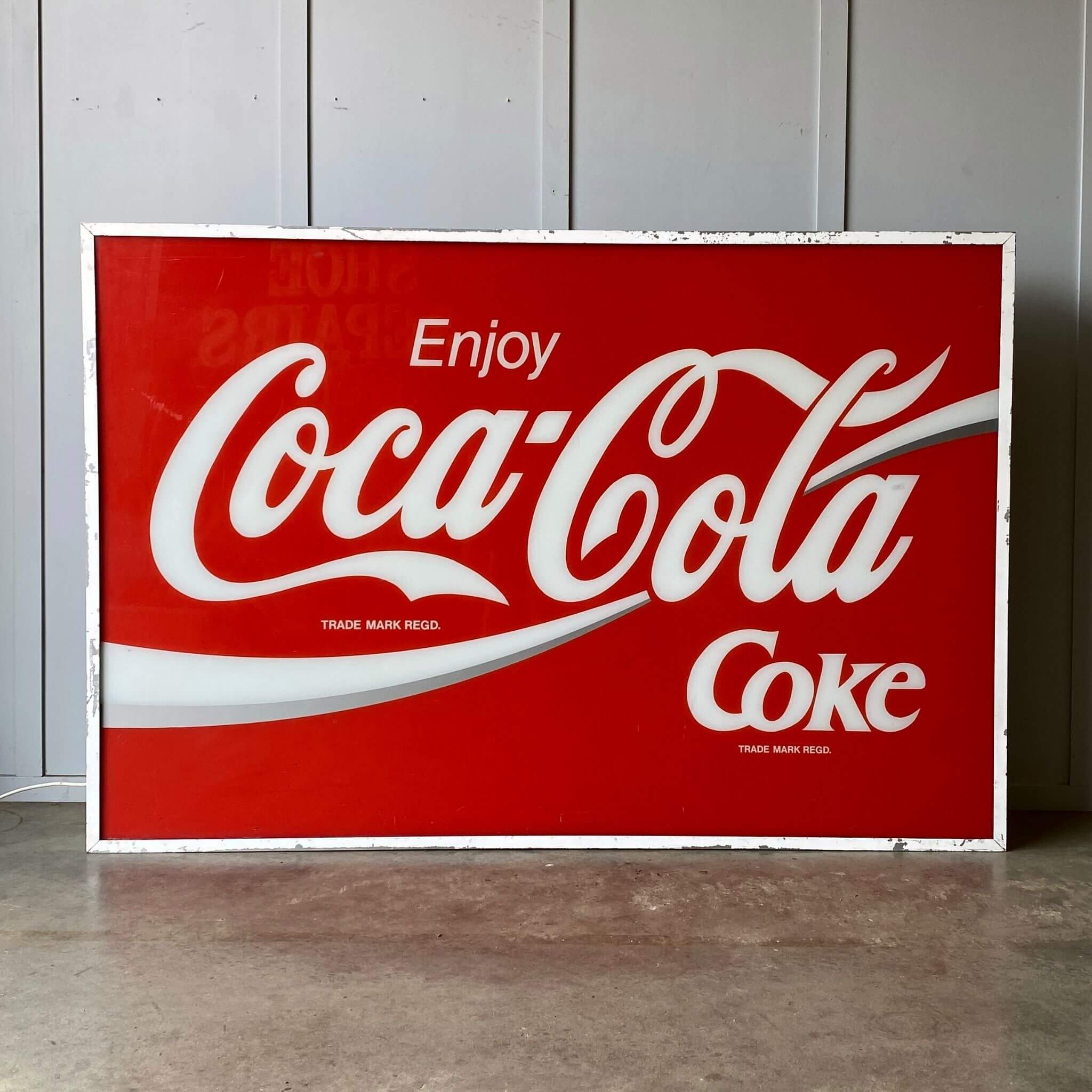 A Coca cola lightbox sign