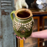 Old green painted pot