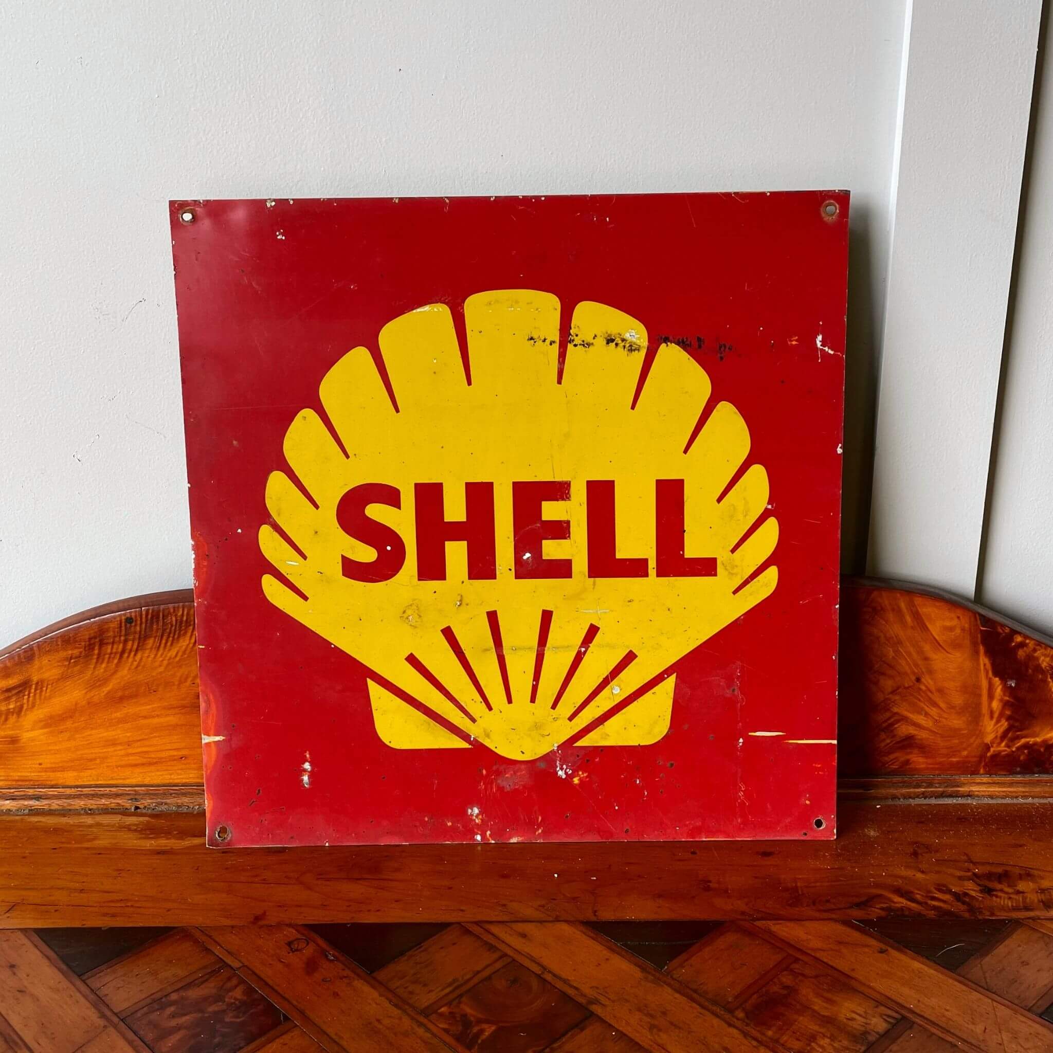 A vintage advertising shell bowser sign