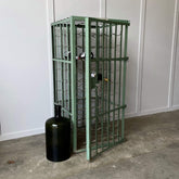 A wine cabinet and glass carboy